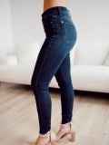 Dark blue high waisted metal button skinny jeans